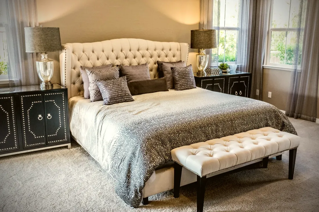 Upholstered bed with a tufted headboard