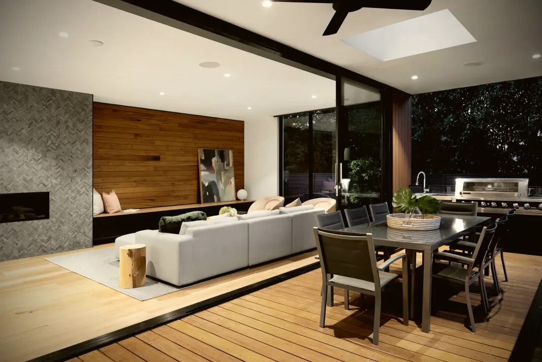 Open living space with a timber and stone feature wall