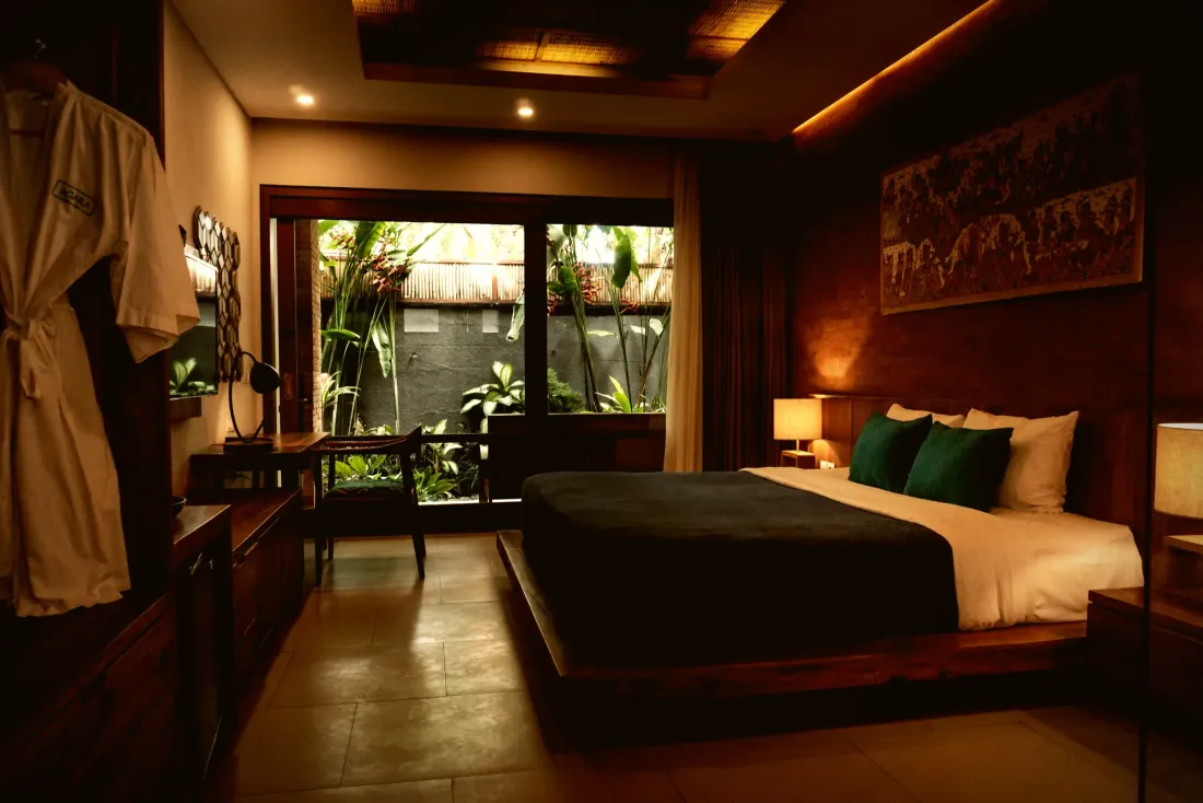 Bedroom with a timber ceiling detail and warm concealed lighting